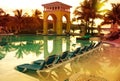 Pavilion on a sunset and the pool with reflection Royalty Free Stock Photo