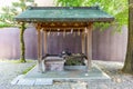 Pavilion for washing of hands rite known as temizu, at Suwa Shinto shrine in Kanazawa, Japan. Royalty Free Stock Photo