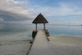 Pavilion on white sand beach in Maldive island resort Royalty Free Stock Photo