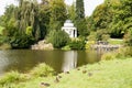 Pavillion in Mountainpark Kassel, Bergpark Wilhelmshoehe, Kassel, Germany. Ducks on meadow in front of pond. Royalty Free Stock Photo