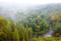 Forest river landscape draped in fog at autumn Royalty Free Stock Photo