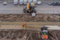 Poland Ostrowiec Swietokrzyski February 5, 2024 at 1:10 p.m. Hitachi loader and Volvo excavator - sidewalk construction . Royalty Free Stock Photo