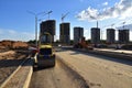 Paving roller machine during road work. Mini road roller at construction site for paving works. Screeding the sand for road Royalty Free Stock Photo