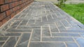 Paving slabs forming a herringbone pattern walkway Royalty Free Stock Photo
