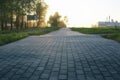 Paving stone path goes away the prospect in sunset Royalty Free Stock Photo