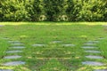 Paving stone tile walkway on green yard in the garden Royalty Free Stock Photo