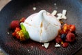 Pavlova berry cake with passion cream, strawberry, meringue. Delicious sweet dessert food closeup served for lunch in Royalty Free Stock Photo