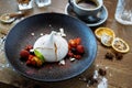 Pavlova berry cake with passion cream, strawberry, meringue. Delicious sweet dessert food closeup served for lunch in Royalty Free Stock Photo