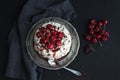 Pavlova cake with fresh cherry, cheese cream and