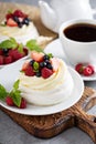 Pavlova cakes with cream and fresh berries Royalty Free Stock Photo