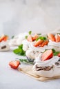 Pavlova cakes with whipped cream and fresh summer berries. Royalty Free Stock Photo