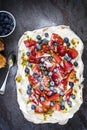 Pavlova Meringue Cake with Berries and Passionfruit Top View