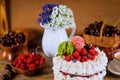 Pavlova meringue cake with cream and berries