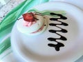 Pavlova merinque desserts topped with strawberries and a chocolate drizzle Royalty Free Stock Photo