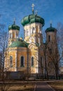 Pavlovsky Cathedral on a sunny spring day. The blue sky, green domes and the yellow walls of the cathedral. Gatchina