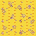 Orange and purple dog`s foot digital print on yellow background