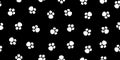 Paw dog seamless pattern. Pet, cat and puppy paws on black background. Footprint of panda. Cartoon animal texture for print. Cute Royalty Free Stock Photo