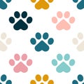 Paws or footprints of cats and dogs on a white background create a cute seamless pattern