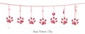 Paw prints with hanging red hearts Royalty Free Stock Photo