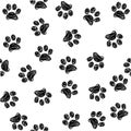 Seamless pattern with doodle dog paws. Black color animal print. Vector background. Royalty Free Stock Photo