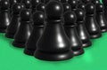 3d group of black chess pawns on green background