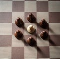Pawn on chess board surrounded by adversary concept of adversity ,discimination ,equality Royalty Free Stock Photo