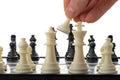 Pawn in hands over a chessboard