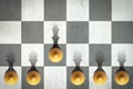 Pawn with the shadow of the queen, in front of the pawns. Top view. Leadership concept. Strength and aspirations Royalty Free Stock Photo