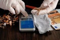 Pawnshop worker using jewelry scales with gold jewelry, top view, flat lay