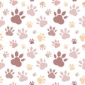 Paws pattern. Silhouettes of paws, cat s feet, dog s footprint. Pastel pink, nude on a transparent background. Seamless