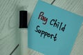 Pay Child Support write on sticky notes isolated on Wooden Table Royalty Free Stock Photo