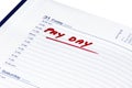 Pay day written in red in a diary Royalty Free Stock Photo