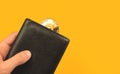 Pay with Ethereum concept background, man hold black leather wallet with cryptocurrency coin, financial and business
