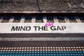 Pay gap, Mind the pay gap graffiti in pink on platform , gender pay inequality concept illustration