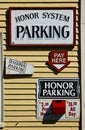 Pay parking sign and red money box on wall Royalty Free Stock Photo