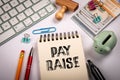 PAY RAISE. Money, computer keyboard and stationery on white office table Royalty Free Stock Photo