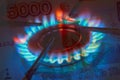 Pay for Russian gas in roubles concept. Russia Sanctions and Ukraine war concept. Blue gas burning from a kitchen gas stove with