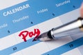Pay word on calendar Royalty Free Stock Photo