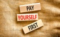 Pay yourself first symbol. Concept words Pay yourself first on beautiful wooden blocks. Beautiful canvas table canvas background. Royalty Free Stock Photo