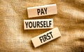 Pay yourself first symbol. Concept words Pay yourself first on beautiful wooden blocks. Beautiful canvas table canvas background. Royalty Free Stock Photo