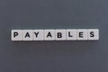 Payables word made of square letter word on grey background