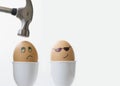 Boiled eggs with smiley face expressions, violence, punishment, gangster, bullying concept Royalty Free Stock Photo