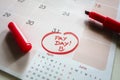 Payday end of month date on calendar with red marker and circled day of salary Royalty Free Stock Photo