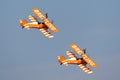 Breitling Wing walkers barnstorming flying display in vintage Boeing Stearman biplanes Royalty Free Stock Photo