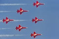 Patrouille Suisse formation display team of the Swiss Air Force flying Northrop F-5E fighter aircraft joined by the Swiss PC-7 tea