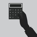 Paying bills.Calculator icon and .Hand holding calculator.