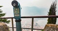 Paying blue telescope to watch the city of Como Royalty Free Stock Photo