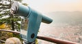 Paying blue telescope to watch the city of Como Royalty Free Stock Photo