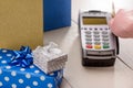 Paying for Christmas gifts by a swipe card Royalty Free Stock Photo