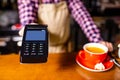 paying by credit card at cafe concept Customer paying for order with a smart phone contactless payment Royalty Free Stock Photo